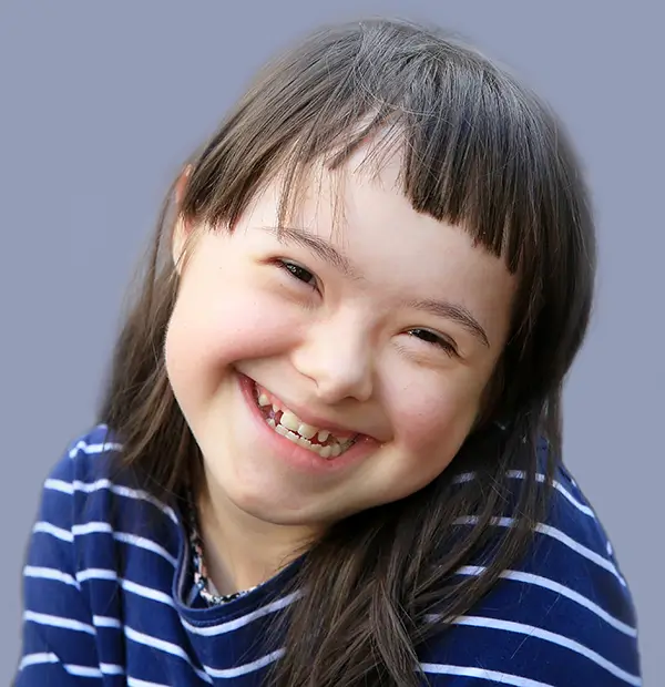 Child smiling during special needs pediatric dentistry visit at Lansdowne Pediatric Dentistry in Lansdowne, VA