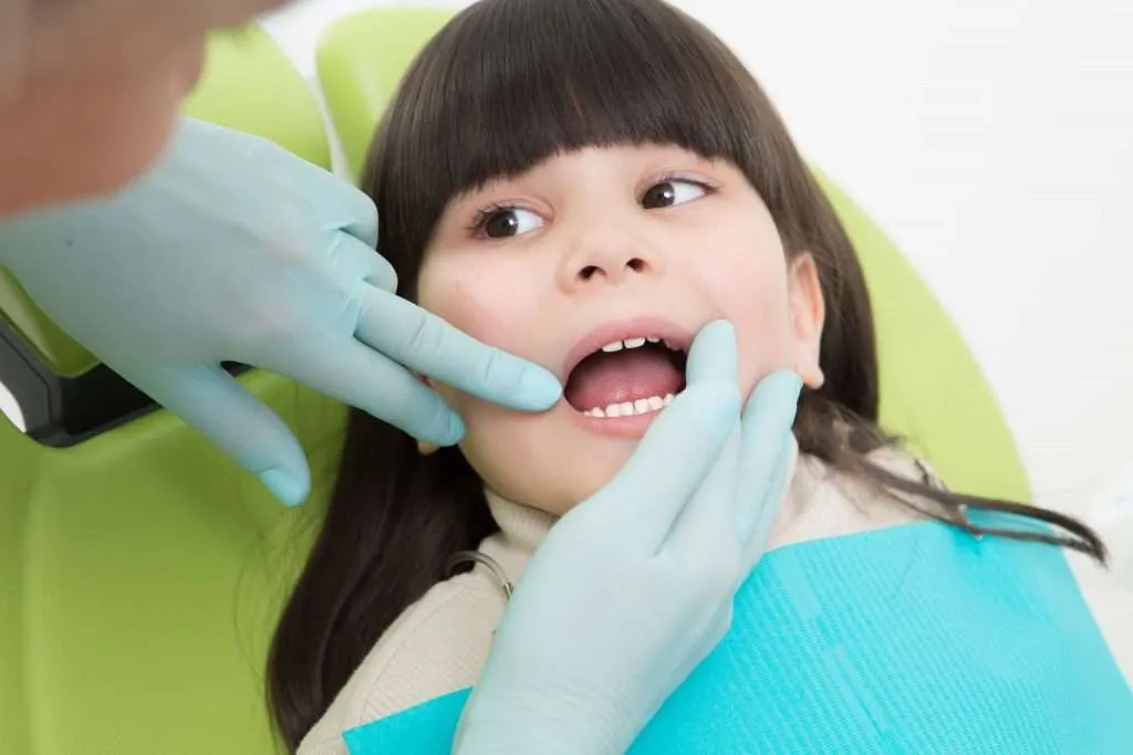Child receiving fluoride treatment at Lansdowne Pediatric Dentistry