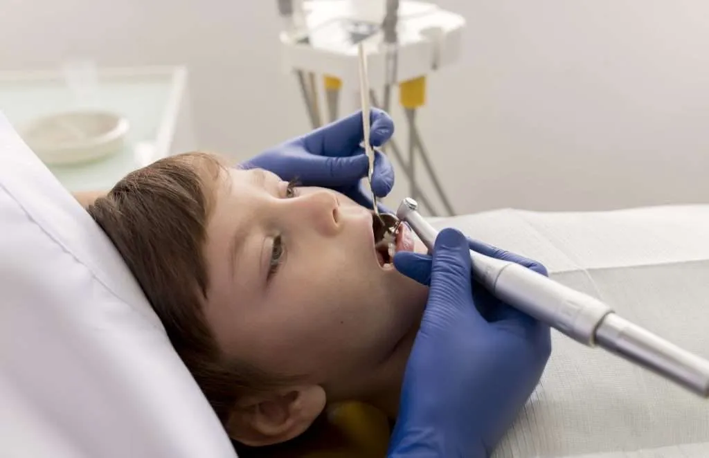 Child receiving gentle pediatric teeth cleaning in Lansdowne, VA